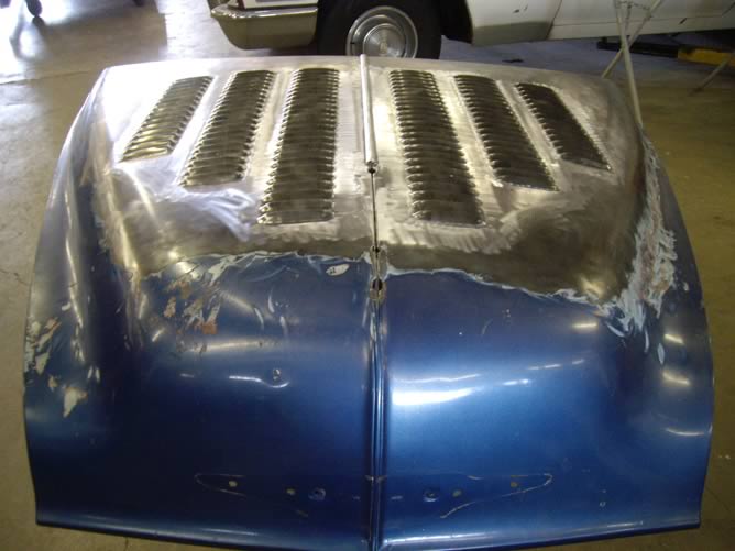 Louvers on the hood of the Oldsmobile.